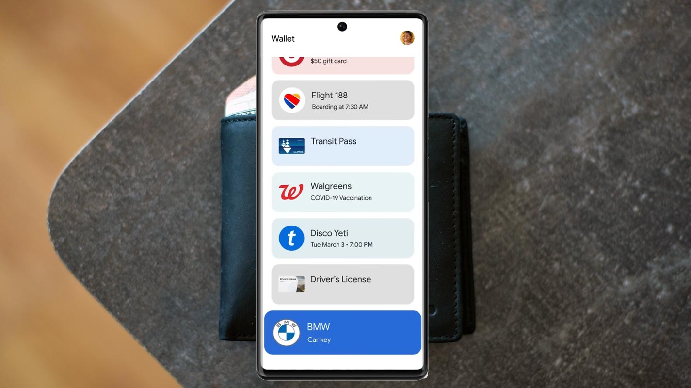 Google Wallet App Infront of Real Wallet